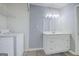 Functional laundry area featuring a vanity with ample counter space, storage and appliances at 24317 Plantation Ne Dr, Atlanta, GA 30324