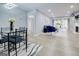 Bright living space with updated floors, lighting, and open floorplan concept into the dining area at 24317 Plantation Ne Dr, Atlanta, GA 30324