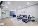 Modern living room featuring an open floor plan, updated kitchen, and contemporary furnishings at 24317 Plantation Ne Dr, Atlanta, GA 30324