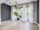 Bright living space with updated floors and a wall of windows featuring natural light at 24317 Plantation Ne Dr, Atlanta, GA 30324