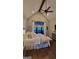 Bright main bedroom with a large window offering natural light, ceiling fan, and modern decor at 251 Merrell Rd, Carrollton, GA 30116