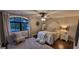 This cozy bedroom features a full-sized bed, ceiling fan, a window and lots of decor to make you feel at home at 251 Merrell Rd, Carrollton, GA 30116