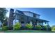 Spacious back porch with an outdoor entertainment area and fireplace at 251 Merrell Rd, Carrollton, GA 30116