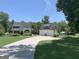 Charming exterior with a lush green lawn and a two car garage at 251 Merrell Rd, Carrollton, GA 30116