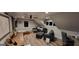 Finished bonus room with dark sofa, desk, and ample lighting for a cozy workspace at 251 Merrell Rd, Carrollton, GA 30116
