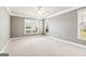 Spacious bedroom with plush carpeting, natural light, and ample space at 3725 Downing Dr, Cumming, GA 30040