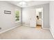 Carpeted bedroom includes a ceiling fan and adjacent bathroom at 3725 Downing Dr, Cumming, GA 30040