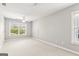 Spacious carpeted bedroom with ample natural light and neutral paint at 3725 Downing Dr, Cumming, GA 30040