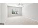 Bright carpeted bedroom with a large window at 3725 Downing Dr, Cumming, GA 30040
