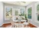 Cozy breakfast nook featuring a glass table, white chairs, and plenty of natural light at 3725 Downing Dr, Cumming, GA 30040