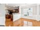 Bright dining area with hardwood flooring and wainscoting at 3725 Downing Dr, Cumming, GA 30040