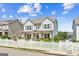 Charming two-story home features a welcoming porch and a lovely white picket fence at 3725 Downing Dr, Cumming, GA 30040