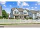 Charming two-story home features a welcoming porch and a lovely white picket fence at 3725 Downing Dr, Cumming, GA 30040