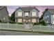 Charming two-story home features a welcoming porch and a lovely white picket fence at 3725 Downing Dr, Cumming, GA 30040