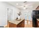 Kitchen island with granite countertop and seating at 3725 Downing Dr, Cumming, GA 30040