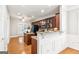 Open kitchen features granite countertops, stainless appliances, and a breakfast bar at 3725 Downing Dr, Cumming, GA 30040