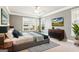 Stylish main bedroom with modern decor, large windows, and a comfortable king-size bed at 3725 Downing Dr, Cumming, GA 30040