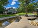Scenic view of the home from the wooden dock, featuring lush lawn and landscaping at 50 Birch Road, Covington, GA 30014