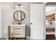 Tastefully designed bathroom with a modern vanity, stylish mirror, and easy access to the bedroom at 50 Birch Road, Covington, GA 30014