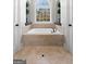 Relaxing bathtub with natural light, perfect for unwinding after a long day at 50 Birch Road, Covington, GA 30014