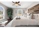 Spacious bedroom with wood accent wall, neutral colors, and a beautiful natural light at 50 Birch Road, Covington, GA 30014