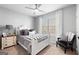 Charming bedroom featuring neutral decor, natural light, and elegant furnishings at 50 Birch Road, Covington, GA 30014