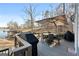 Enjoy outdoor dining on this spacious deck with a lake view, complete with a grill and an outdoor dining set at 50 Birch Road, Covington, GA 30014