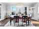 Elegant dining room with stylish chandelier, large windows, and views of the lake at 50 Birch Road, Covington, GA 30014