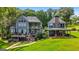 Gorgeous home with an outdoor spa, expansive deck, covered porch and lush green lawn at 50 Birch Road, Covington, GA 30014