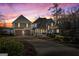 Stunning home exterior at sunset with a lush lawn and inviting curb appeal at 50 Birch Road, Covington, GA 30014