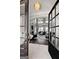 Grand foyer showcasing soaring ceilings, a fireplace, and large windows providing an abundance of natural light at 50 Birch Road, Covington, GA 30014