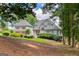 Charming home featuring a well-manicured lawn and a separate garage building at 50 Birch Road, Covington, GA 30014