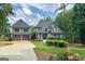 Beautiful home with a lush lawn, a welcoming entrance, and a detached garage at 50 Birch Road, Covington, GA 30014