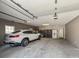 Spacious three-car garage with ample storage space, overhead lighting, and epoxy floors at 50 Birch Road, Covington, GA 30014