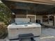 Hot tub with cover under covered patio at 50 Birch Road, Covington, GA 30014