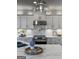 Elegant kitchen featuring white cabinets, granite countertops, and stainless steel appliances at 50 Birch Road, Covington, GA 30014