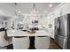 Spacious kitchen features a large island, stainless steel appliances, and stylish pendant lighting at 50 Birch Road, Covington, GA 30014