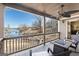 Gorgeous view of the lake from the outdoor porch featuring a fire pit, ceiling fan, and beautiful design at 50 Birch Road, Covington, GA 30014