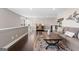 Bright living room showcasing hardwood floors, neutral decor, a comfortable sofa, and a cozy rug at 50 Birch Road, Covington, GA 30014