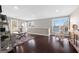 Large living room with hardwood floors, lake view, and stylish decor creating an inviting and comfortable space at 50 Birch Road, Covington, GA 30014