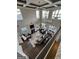 Open living room with fireplace, vaulted ceilings and large windows at 50 Birch Road, Covington, GA 30014