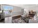 Spacious living room with hardwood floors, lots of natural light, and a serene view of the lake at 50 Birch Road, Covington, GA 30014