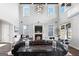 An elegant open-plan living room featuring high ceilings, a fireplace, and exquisite finishes at 50 Birch Road, Covington, GA 30014