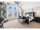 Large bedroom with vaulted ceilings and a wall of bright windows offering scenic views at 50 Birch Road, Covington, GA 30014