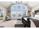 Bright bedroom featuring large windows, comfortable carpet, and access to a personal balcony overlooking the water at 50 Birch Road, Covington, GA 30014