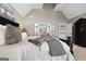Comfortable bedroom featuring carpet, a chandelier, and access to a personal bathroom at 50 Birch Road, Covington, GA 30014