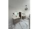 Modern bathroom with dual vanities, marble flooring, and sleek fixtures at 125 Sir Lancelot Ct, Fayetteville, GA 30214