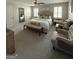 Large Primary bedroom with neutral palette, two seating chairs, lots of natural light and a comfortable seating bench at 125 Sir Lancelot Ct, Fayetteville, GA 30214