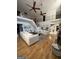 Open-concept living area with hardwood floors, comfortable seating, and staircase at 125 Sir Lancelot Ct, Fayetteville, GA 30214