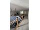 View of the loft overlooking the living room and featuring a gym and exercise equipment, as well as modern railings at 125 Sir Lancelot Ct, Fayetteville, GA 30214